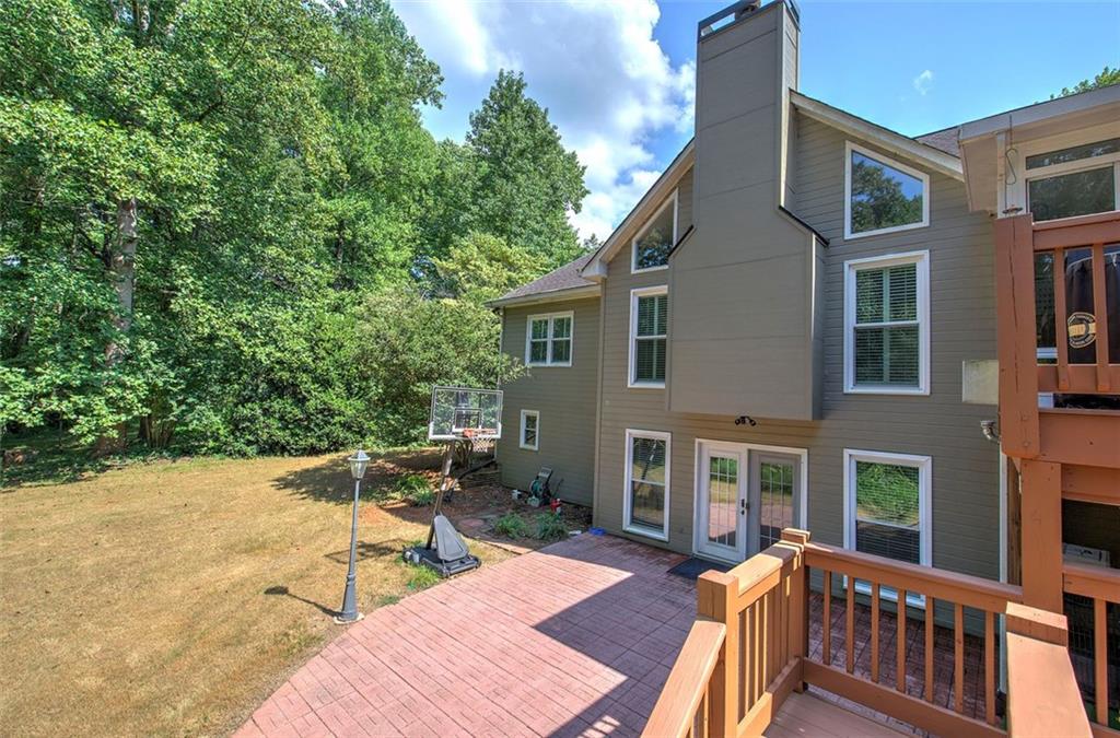 915 Oak Grove Road Carrollton, GA 30117 - Photo 50 of 57 a view of a patio with table and chairs and wooden fence