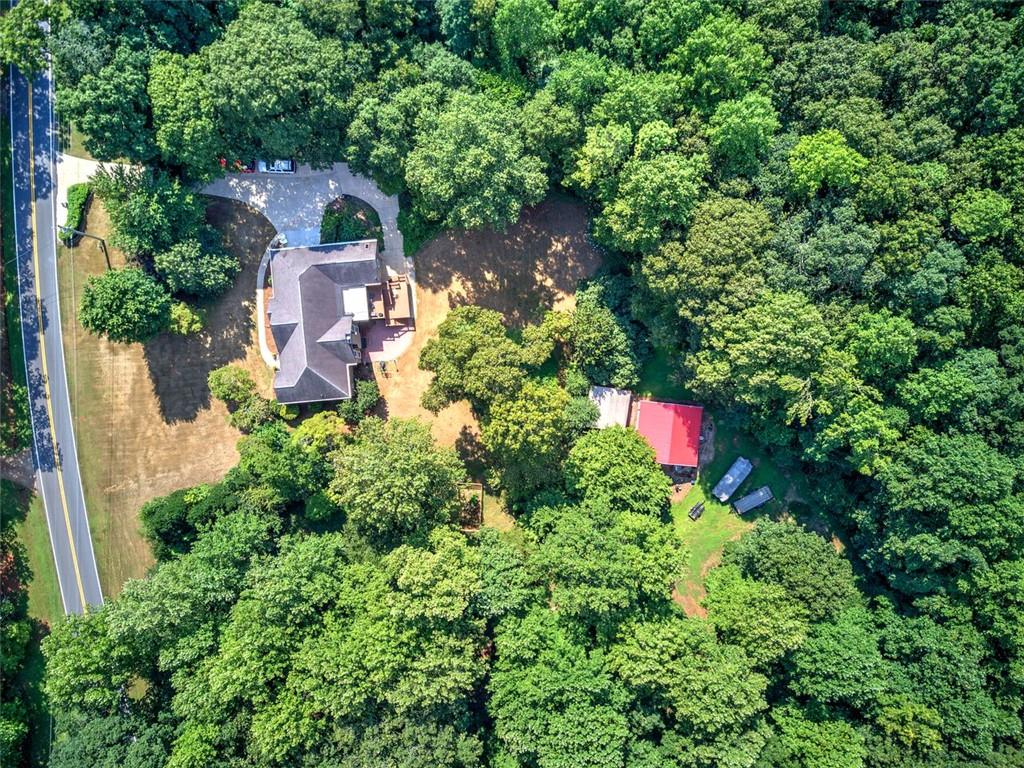 915 Oak Grove Road Carrollton, GA 30117 - Photo 52 of 57 an aerial view of a house with a yard