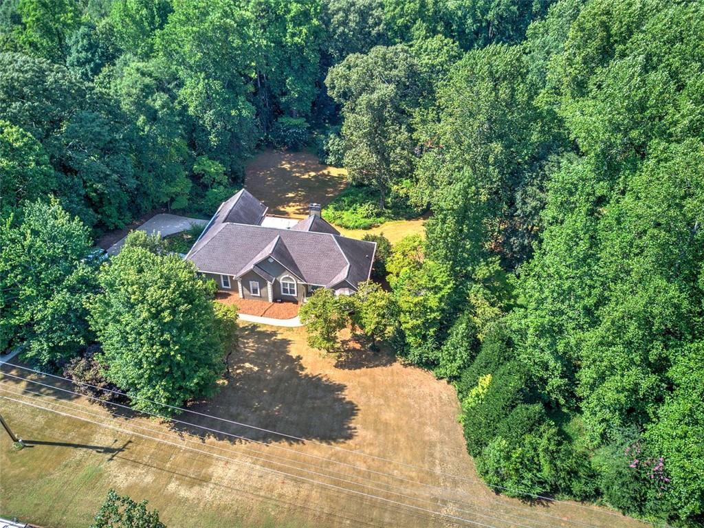 915 Oak Grove Road Carrollton, GA 30117 - Photo 56 of 57 a view of a garden with a patio