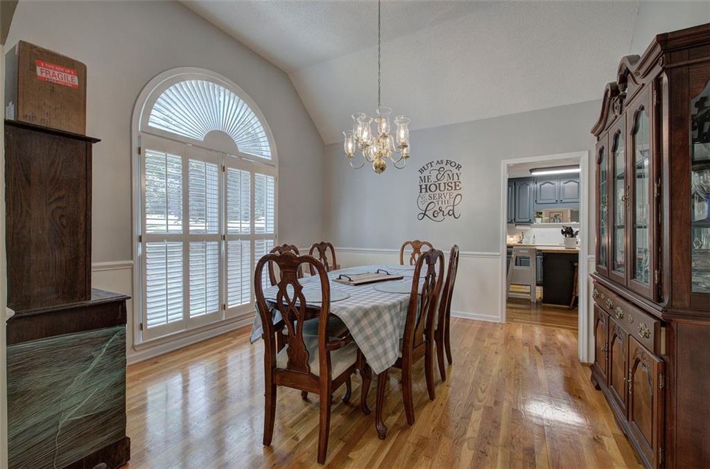 915 Oak Grove Road Carrollton, GA 30117 - Photo 6 of 57 a view of a dining room with furniture window and wooden floor