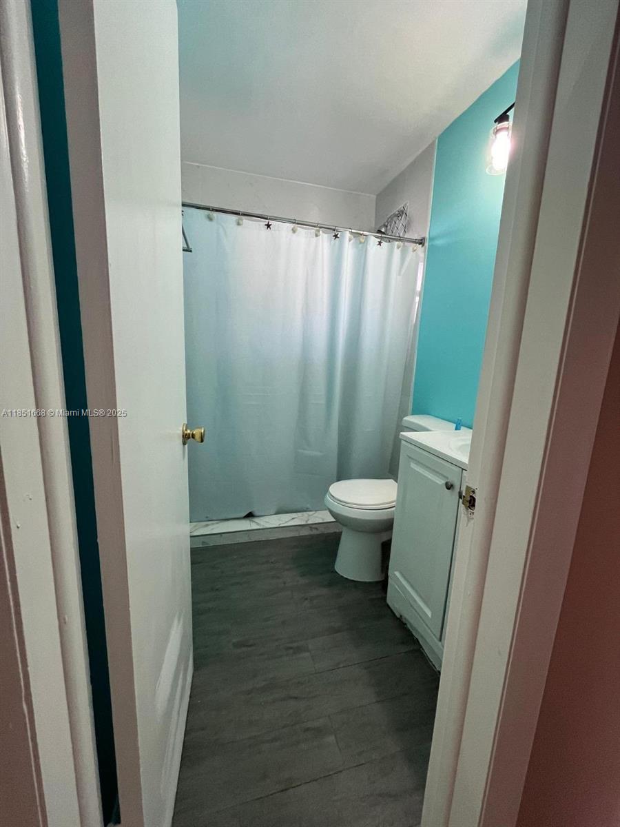 2496 Southwest 17th Avenue, Unit 5301 Miami, FL 33145 - Photo 11 of 19 a bathroom with a sink and a toilet