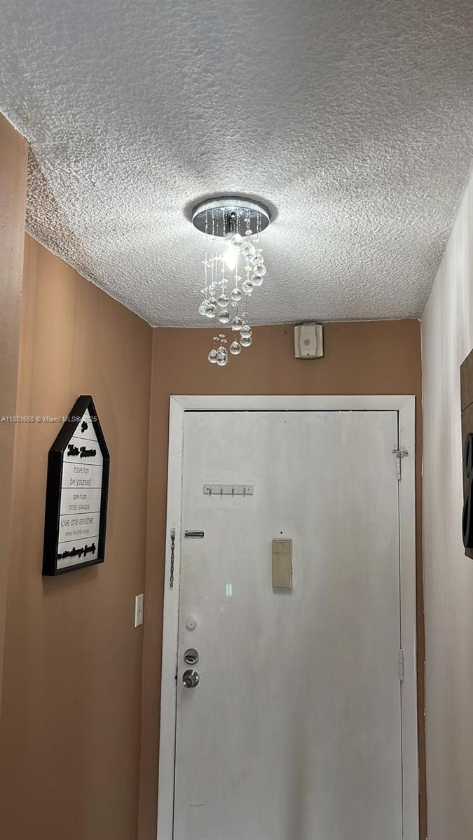 2496 Southwest 17th Avenue, Unit 5301 Miami, FL 33145 - Photo 12 of 19 a view of a chandelier fan