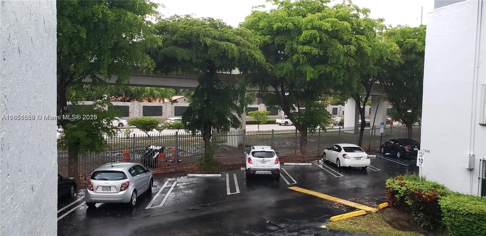 2496 Southwest 17th Avenue, Unit 5301 Miami, FL 33145 - Photo 19 of 19 a car parked in front of a house