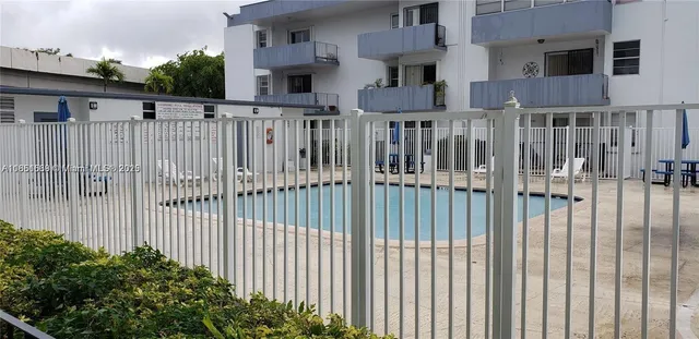 a view of a house with a small yard