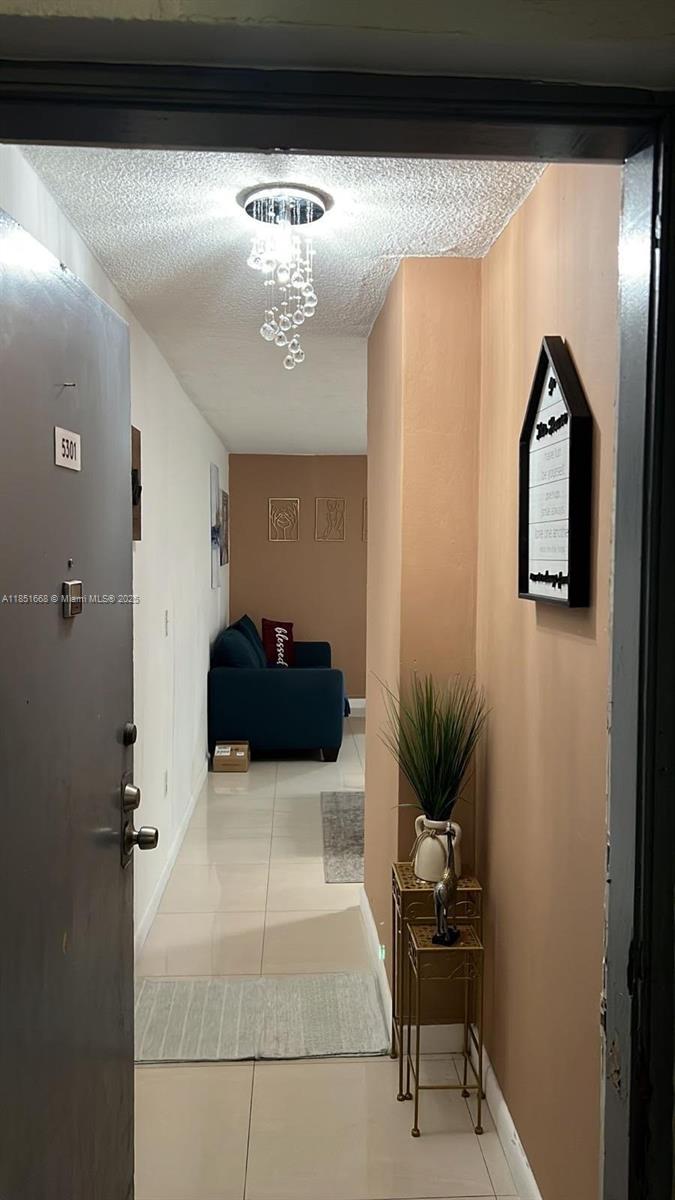 2496 Southwest 17th Avenue, Unit 5301 Miami, FL 33145 - Photo 7 of 19 a living room with furniture and potted plant