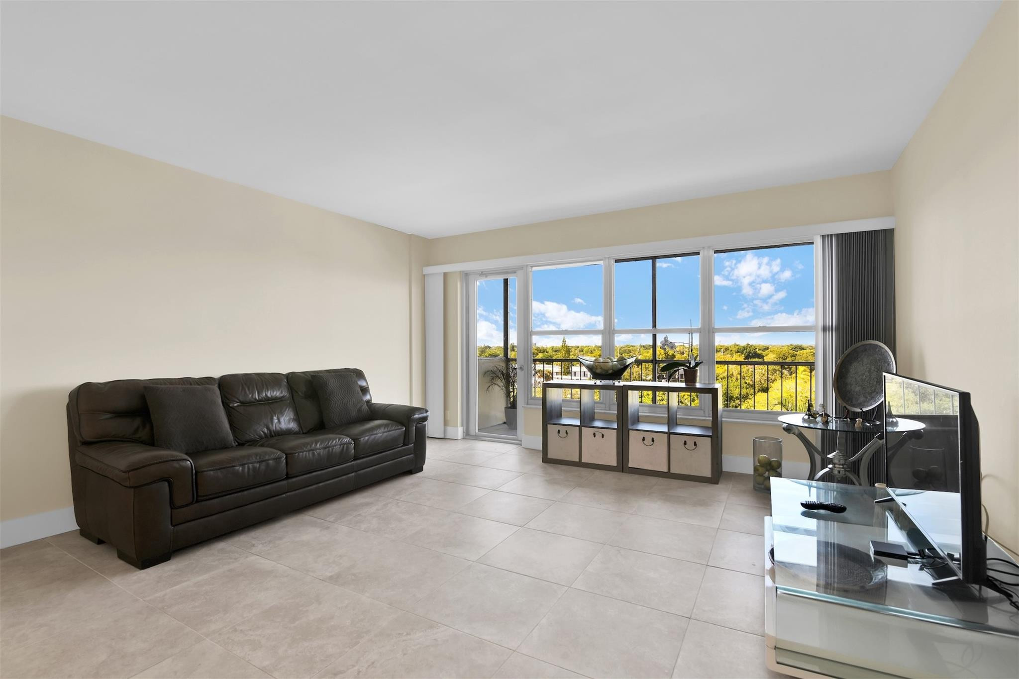 10777 West Sample Road, Unit 711 Coral Springs, FL 33065 - Photo 12 of 45 a living room with furniture and a window