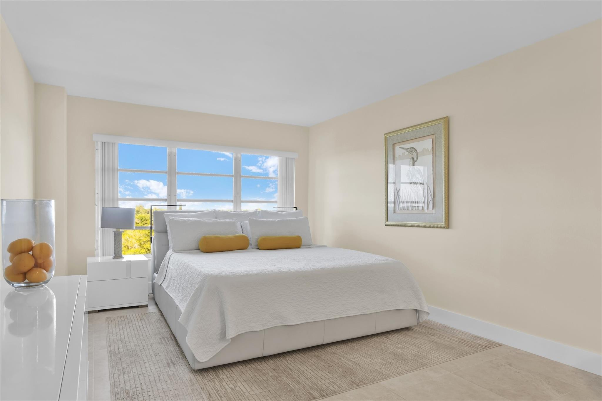 10777 West Sample Road, Unit 711 Coral Springs, FL 33065 - Photo 28 of 45 a bedroom with a bed and a window