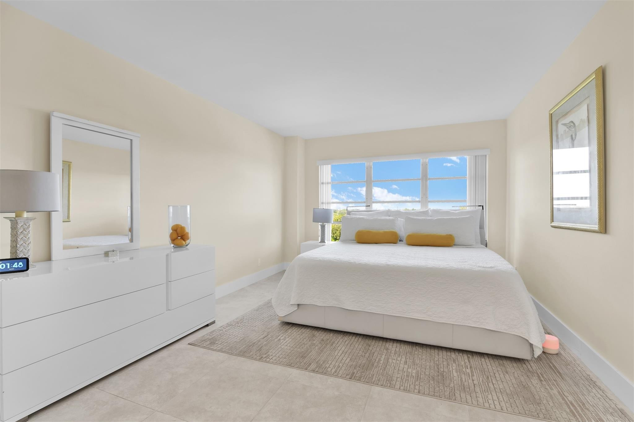 10777 West Sample Road, Unit 711 Coral Springs, FL 33065 - Photo 29 of 45 a bedroom with a bed a table and window