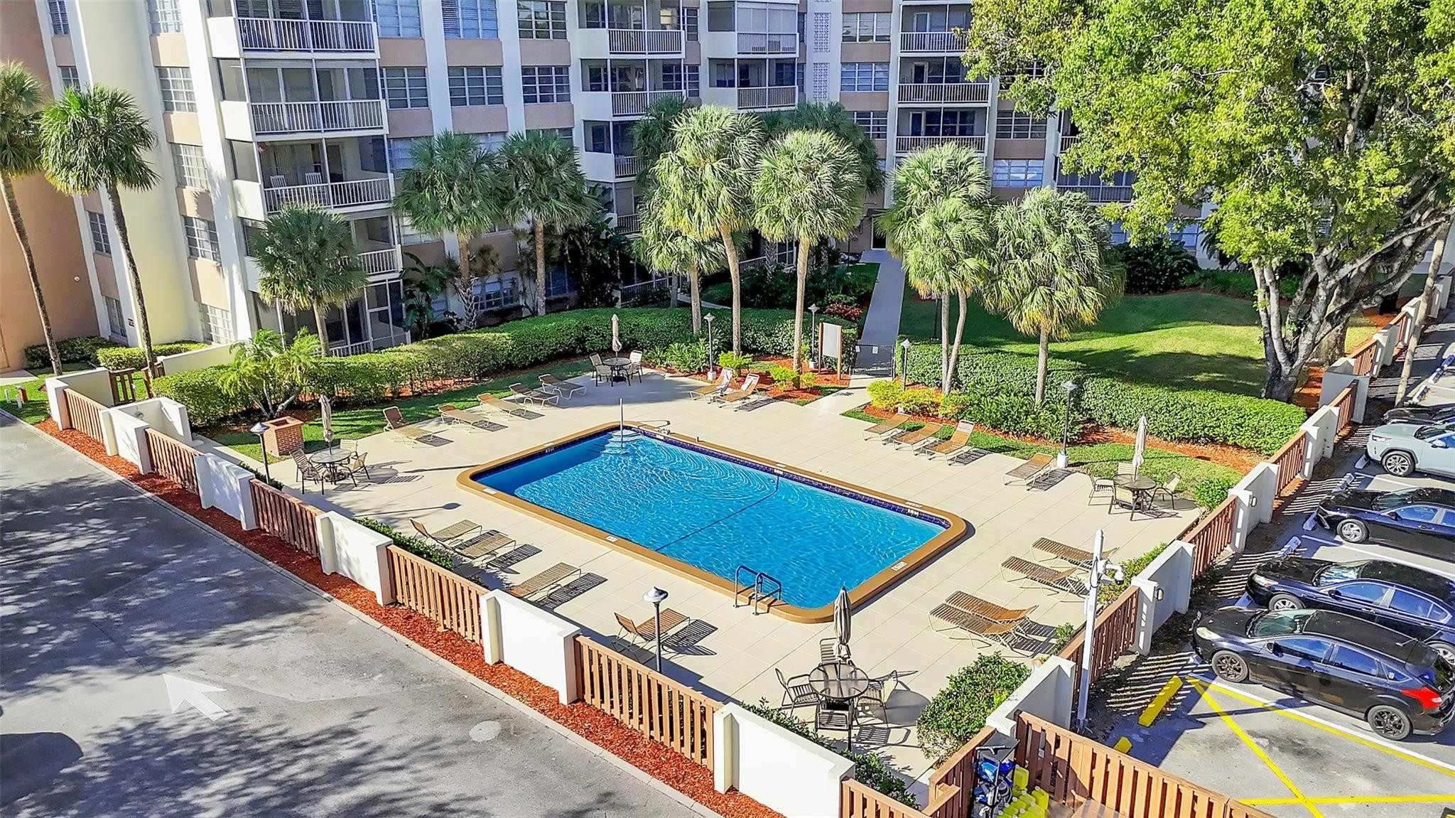 10777 West Sample Road, Unit 711 Coral Springs, FL 33065 - Photo 4 of 45 a view of a backyard with sitting area and furniture