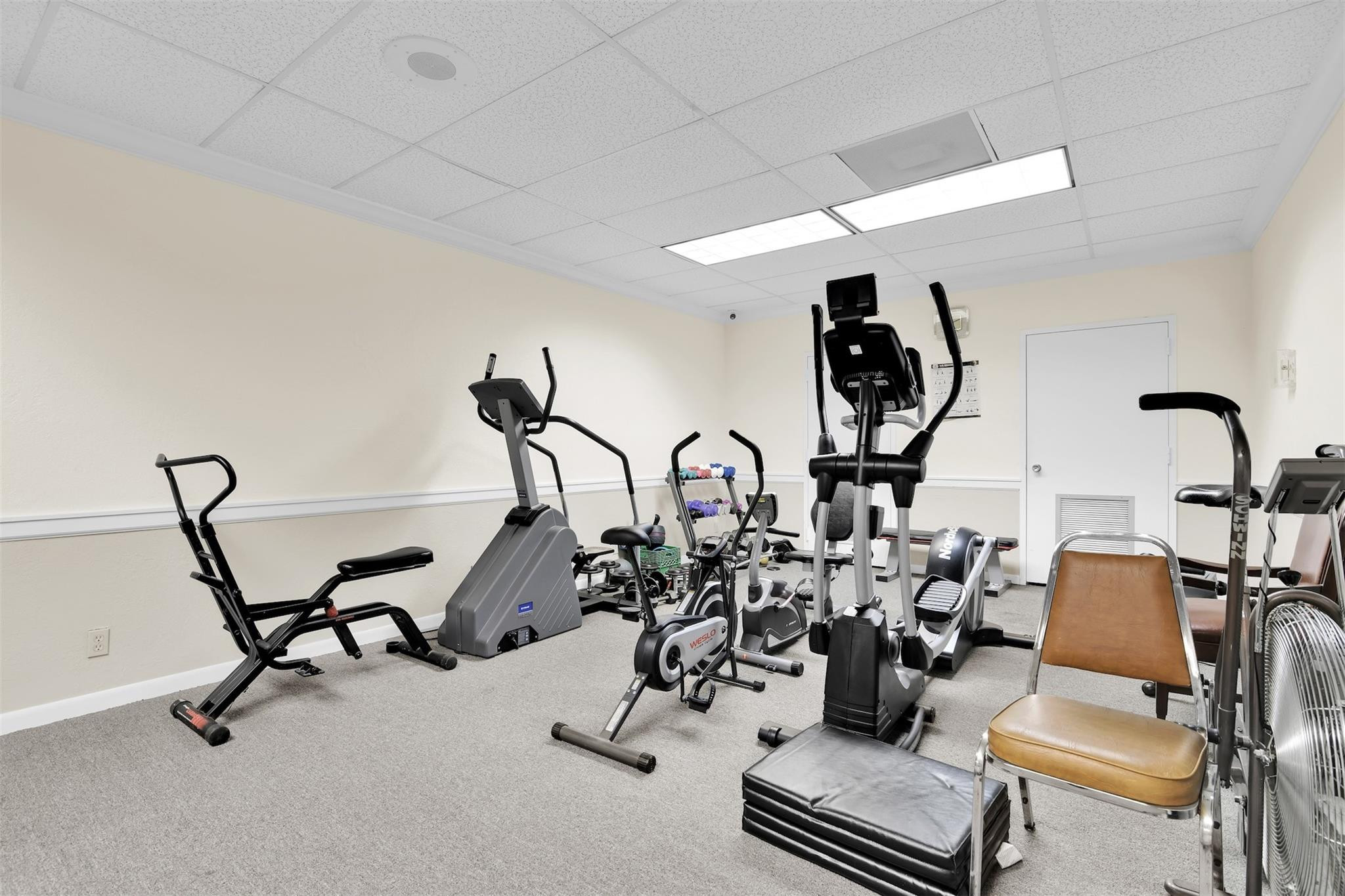 10777 West Sample Road, Unit 711 Coral Springs, FL 33065 - Photo 44 of 45 a view of a room with gym equipment