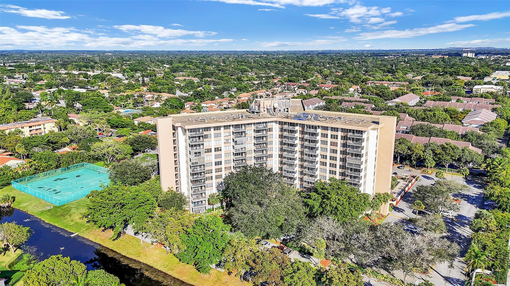 10777 West Sample Road, Unit 711 Coral Springs, FL 33065 - Photo 6 of 45 a view of a city with tall buildings