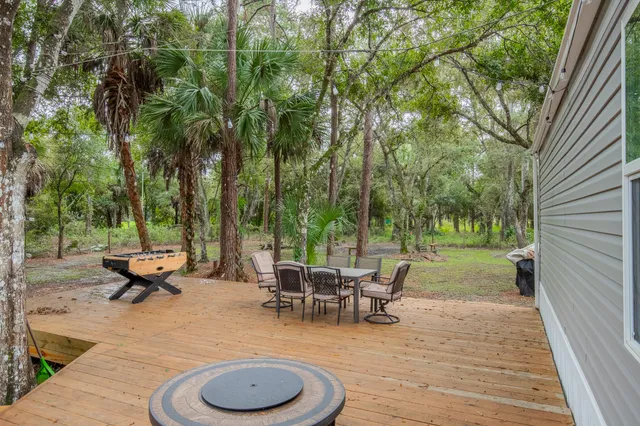 a view of backyard of house with seating space