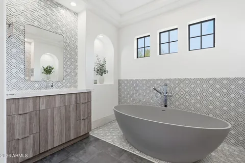 a bathroom with a double vanity sink and a mirror