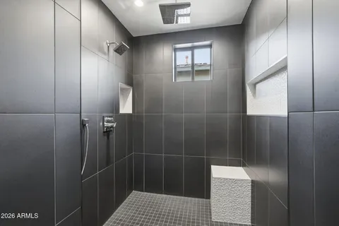 a bathroom with a toilet and a bathtub