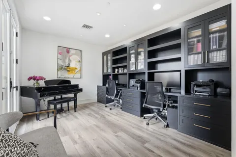 a kitchen with stainless steel appliances granite countertop a sink a stove and a refrigerator