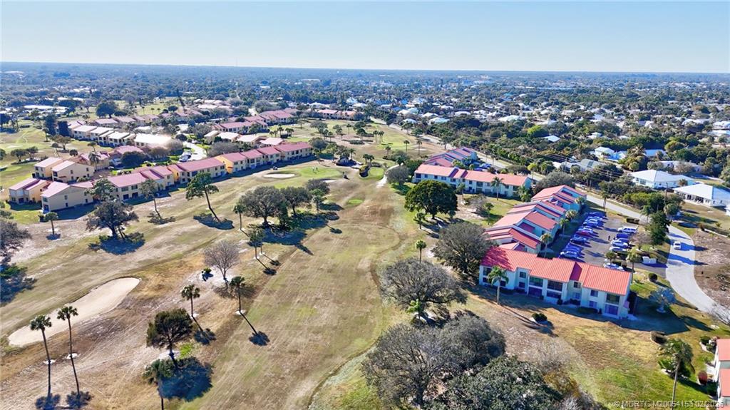 5413 Southeast Miles Grant Road, Unit G206 Stuart, FL 34997 - Photo 55 of 79 an aerial view of residential houses with outdoor space