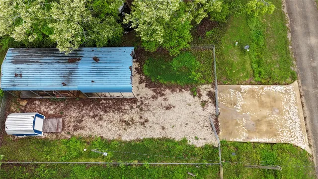 a view of a backyard with sitting area