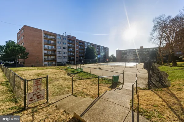 a view of a building next to a big yard