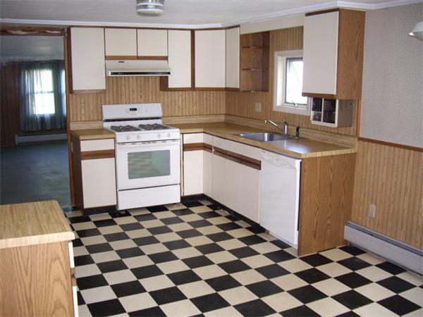 214 West Street Ware, MA 01082 - Photo 8 of 18 a kitchen with a stove a sink and a refrigerator