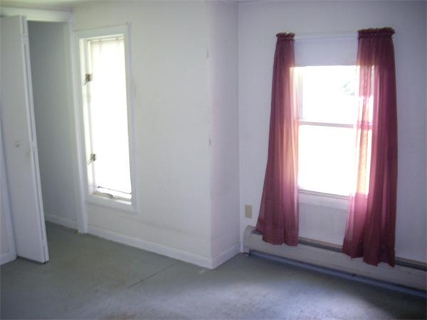 214 West Street Ware, MA 01082 - Photo 10 of 18 a view of an empty room and window