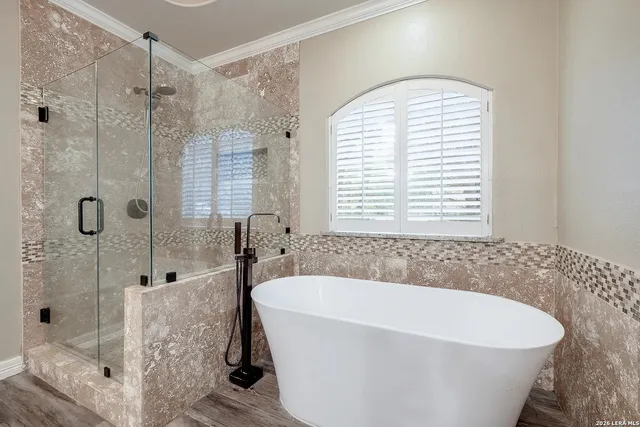 a white bath tub sitting next to a window
