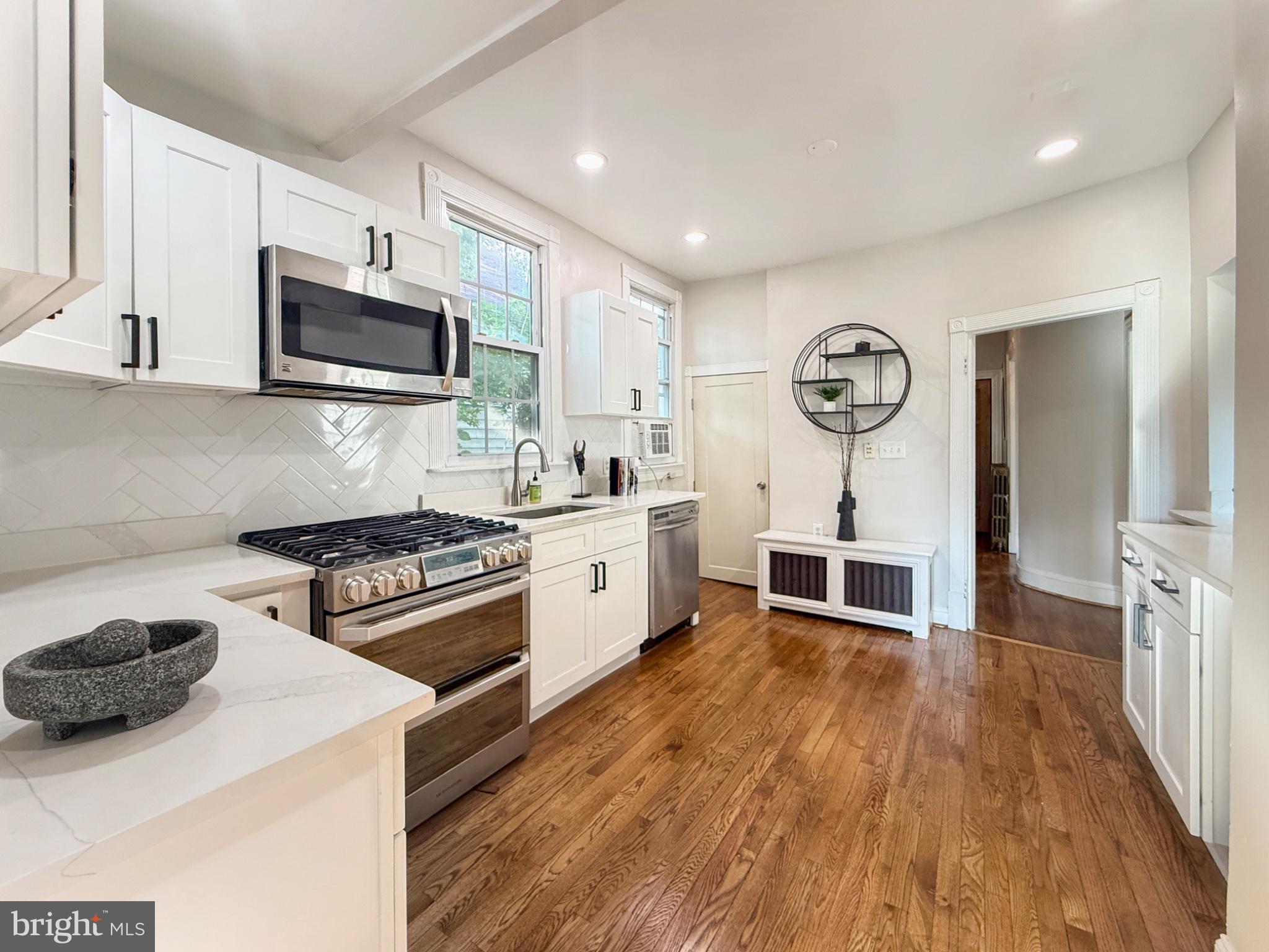3216 18th Street Northeast Washington, DC 20018 - Photo 10 of 47 Modern kitchen with sleek finishes.