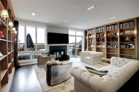 a living room with fireplace furniture and a flat screen tv