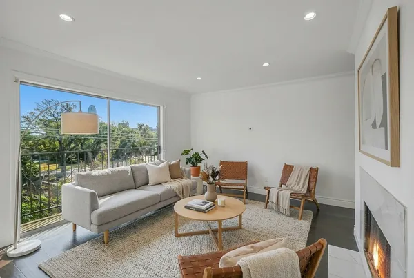 a living room with furniture and a large window
