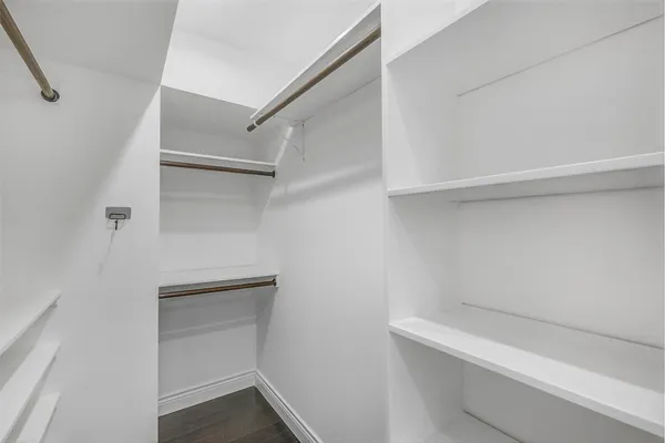 a view of an empty walk in closet