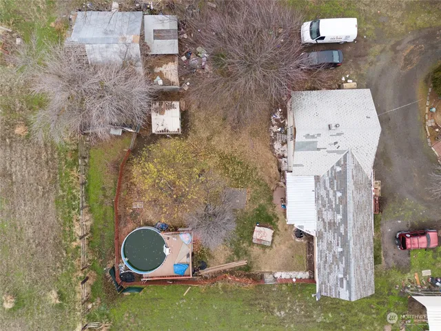 an aerial view of a house with outdoor space
