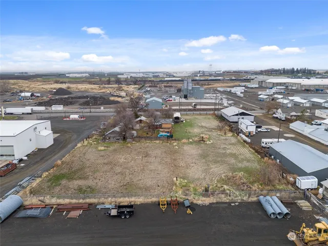 an aerial view of a residential houses with city view