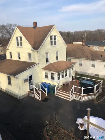 a aerial view of a house with a yard