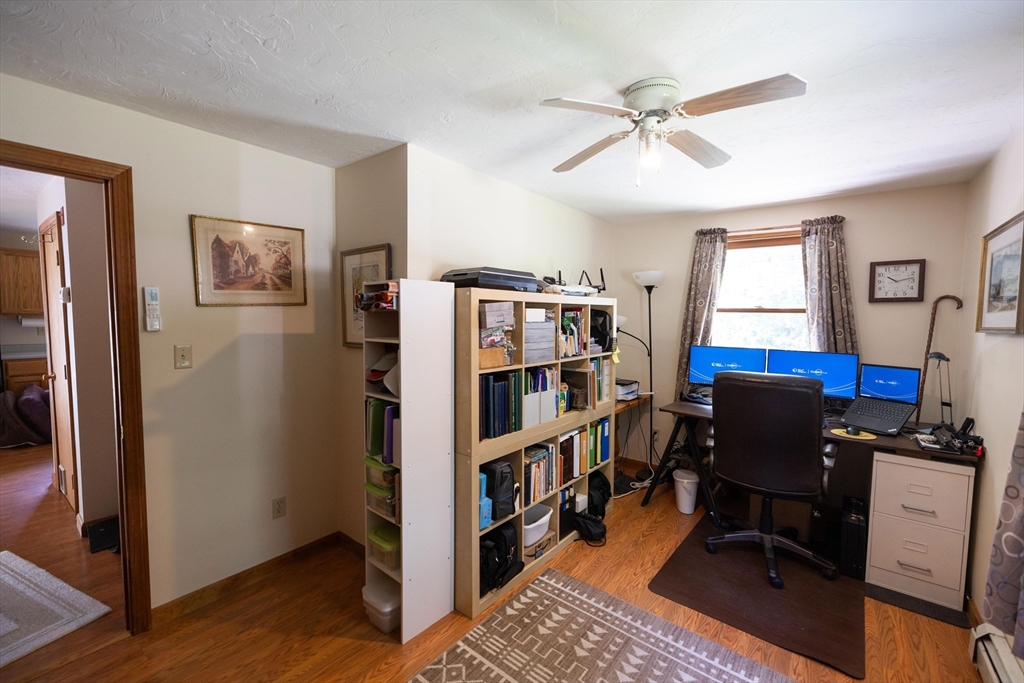 76 Osgood Road Charlton, MA 01507 - Photo 7 of 37 a view of a workspace with furniture and a window