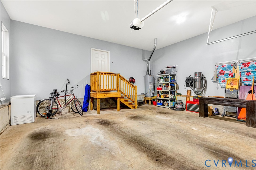 14436 Overlook Ridge Lane Beaverdam, VA 23015 - Photo 65 of 82 a view of a garage with toys and a chandelier