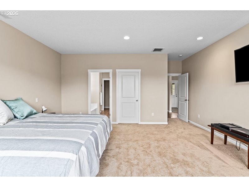 25850 Foster Road Monroe, OR 97456 - Photo 33 of 48 a bedroom with a bed and a flat screen tv