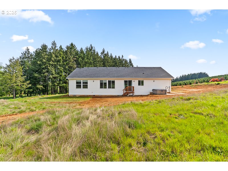 25850 Foster Road Monroe, OR 97456 - Photo 38 of 48 a front view of a house with a garden