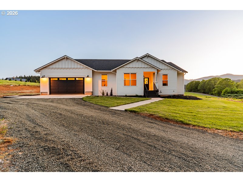 25850 Foster Road Monroe, OR 97456 - Photo 6 of 48 a big room with a big yard and large trees