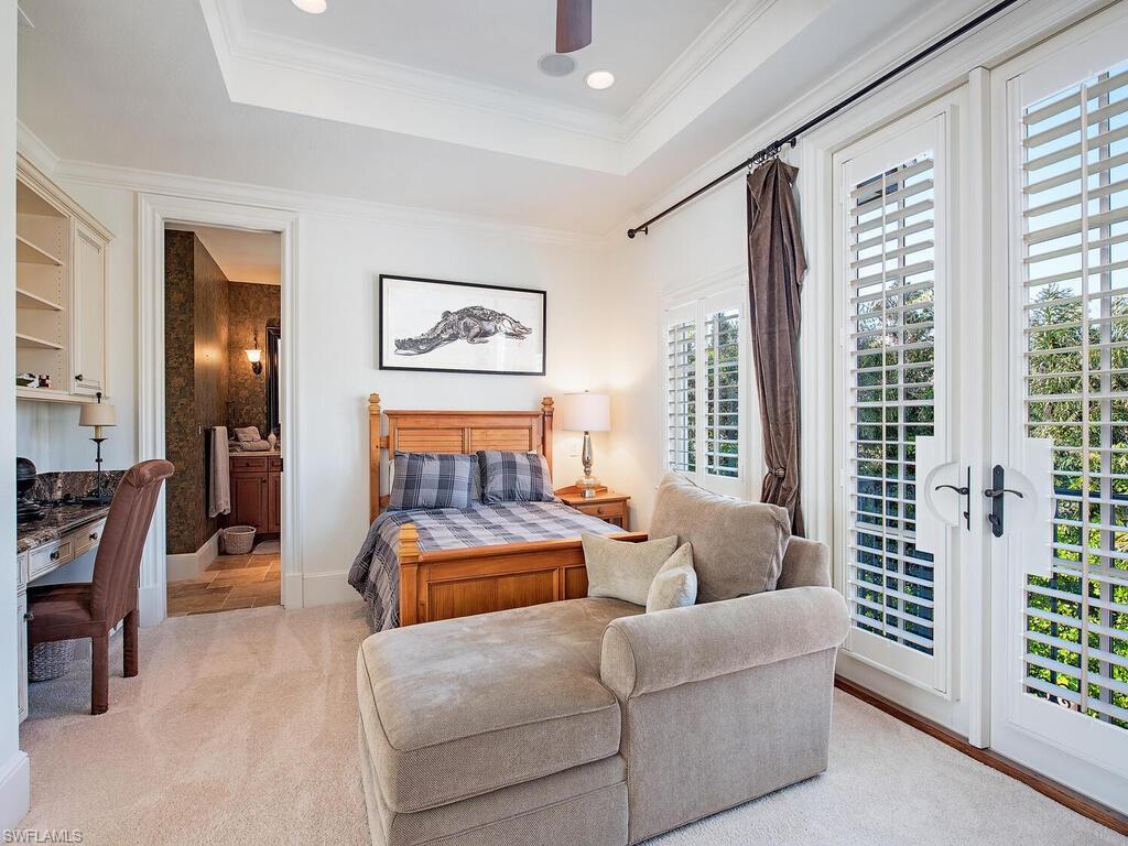 155 20th Avenue South Naples, FL 34102 - Photo 14 of 30 Bedroom featuring ornamental molding, access to outside, a raised ceiling, ceiling fan, and light carpet