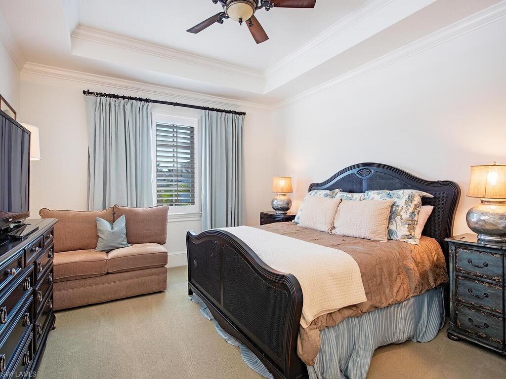 155 20th Avenue South Naples, FL 34102 - Photo 16 of 30 Carpeted bedroom with a raised ceiling, ceiling fan, and crown molding