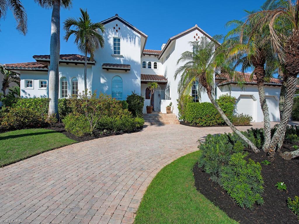 155 20th Avenue South Naples, FL 34102 - Photo 2 of 30 Mediterranean / spanish home with a tiled roof, decorative driveway, and stucco siding