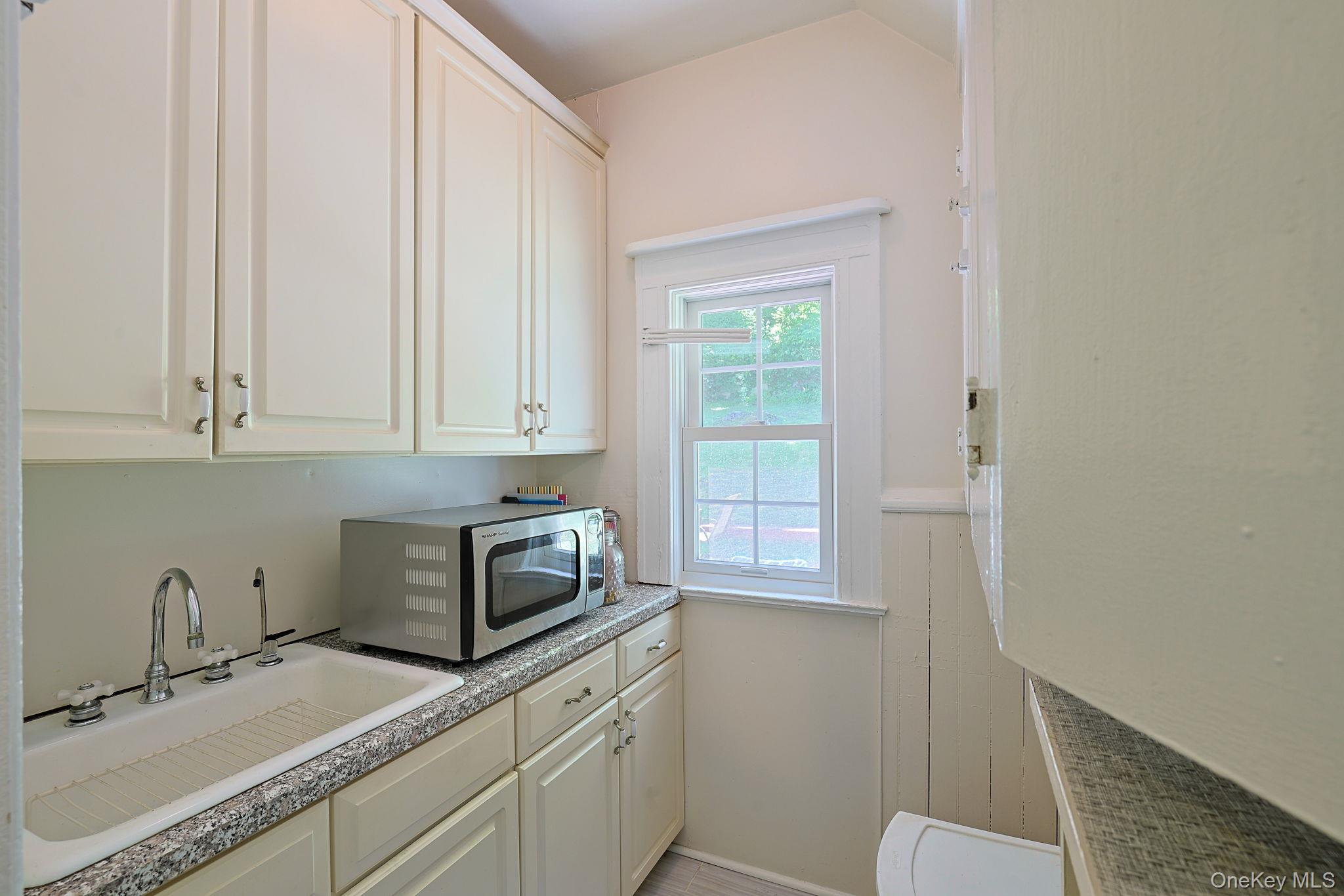 9 Library Road Tuxedo Park, NY 10987 - Photo 12 of 37 Spacious butler pantry with sink and storage cabinets.