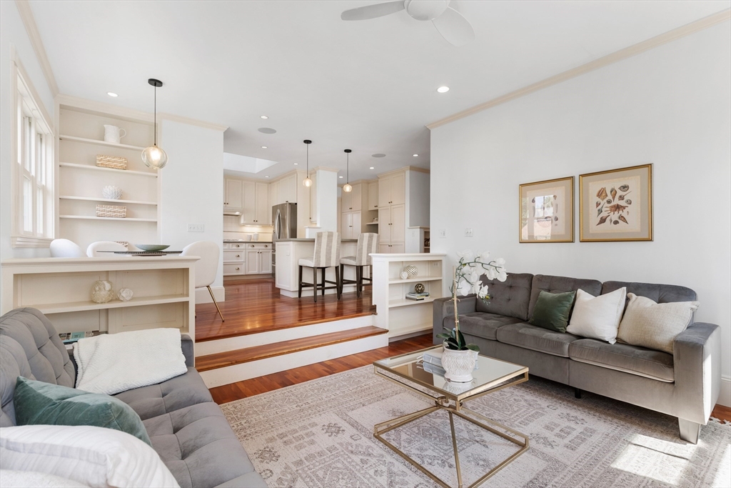 8 Jackson Court Lexington, MA 02421 - Photo 14 of 27 a living room with furniture and a view of kitchen