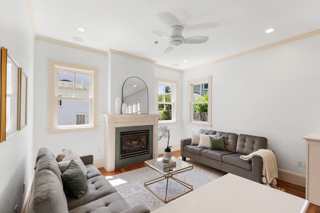 8 Jackson Court Lexington, MA 02421 - Photo 15 of 27 a living room with furniture and a fireplace