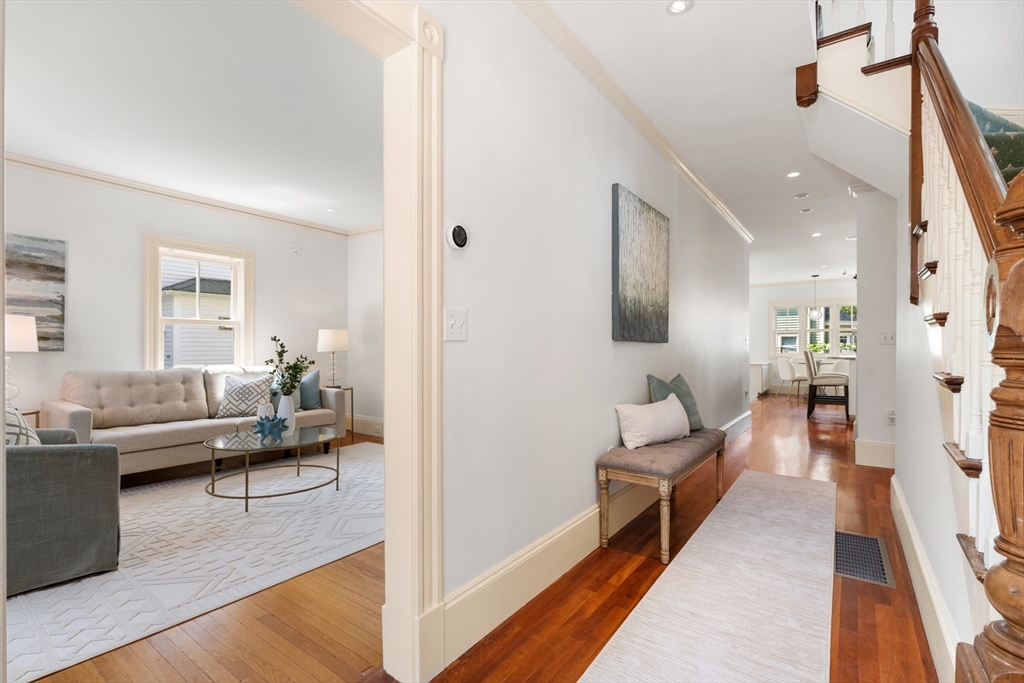 8 Jackson Court Lexington, MA 02421 - Photo 2 of 27 a living room with furniture and a wooden floor