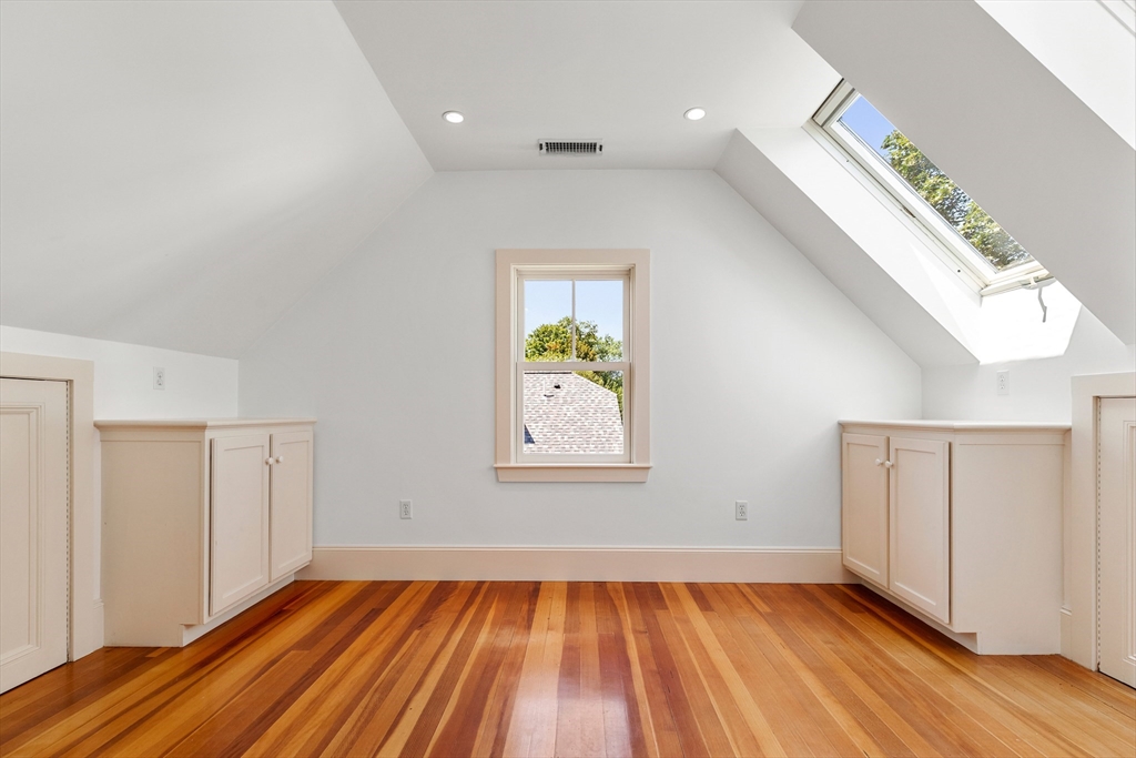 8 Jackson Court Lexington, MA 02421 - Photo 24 of 27 wooden floor in an empty room with a window