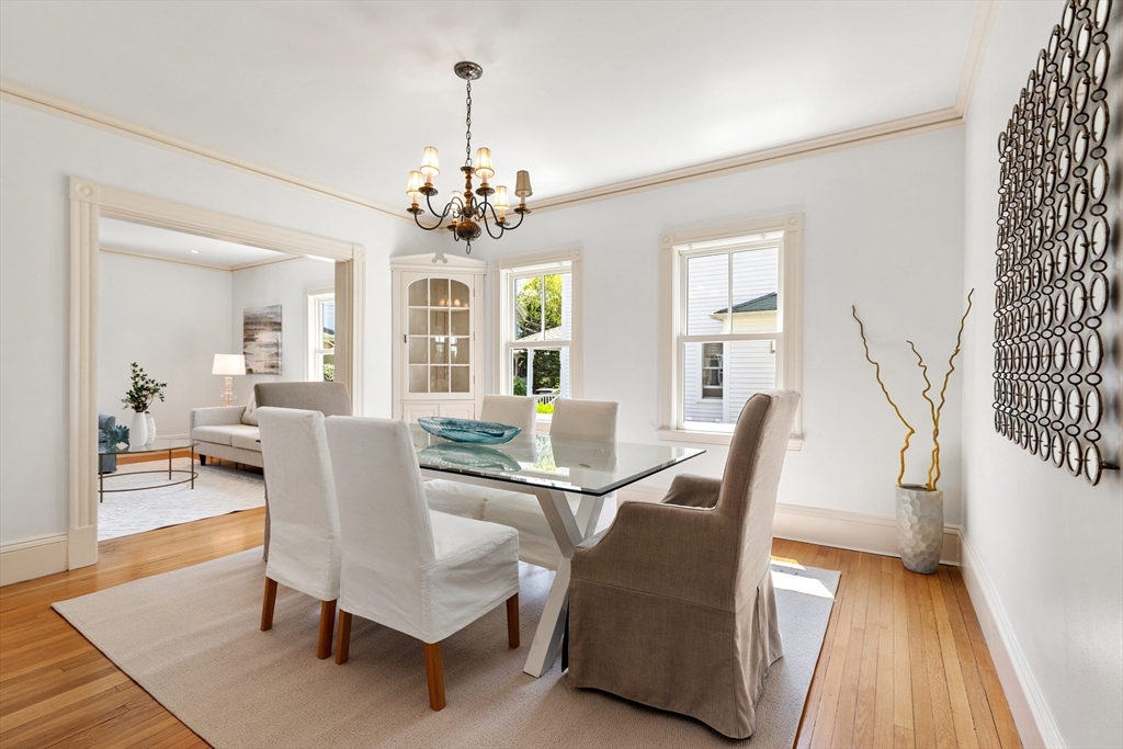 8 Jackson Court Lexington, MA 02421 - Photo 6 of 27 a view of a dining room with furniture wooden floor and chandelier