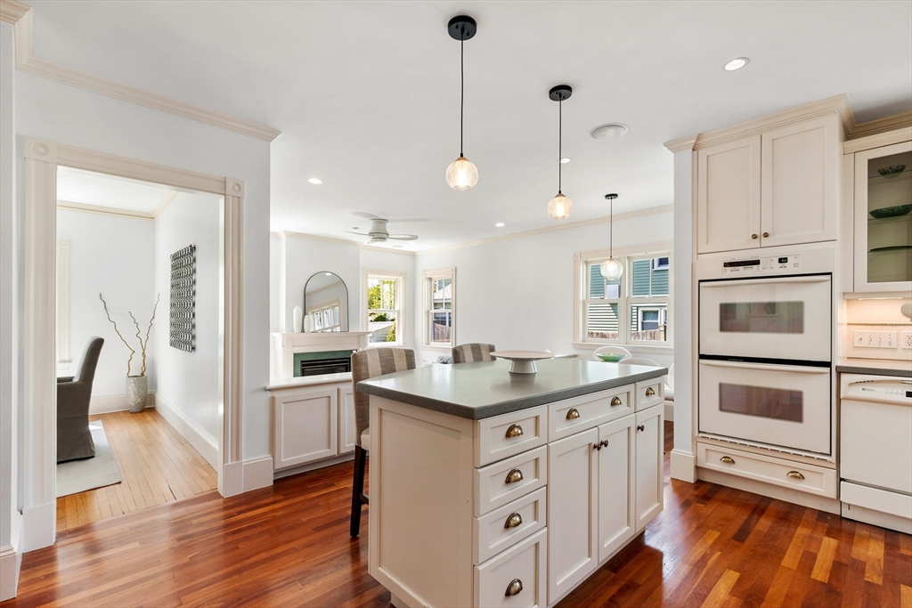 8 Jackson Court Lexington, MA 02421 - Photo 10 of 27 a kitchen with white cabinets and appliances