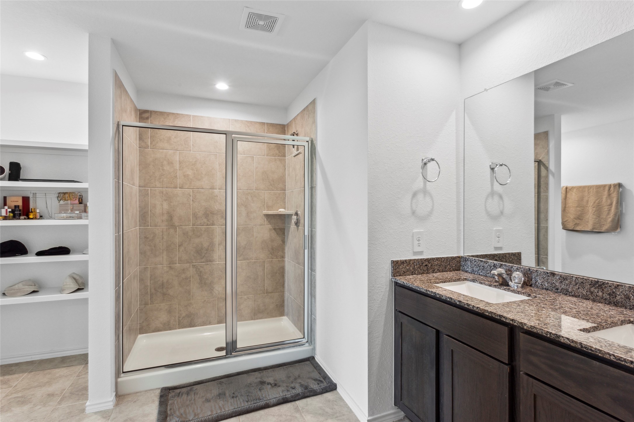 7510 Carson Court Rosharon, TX 77583 - Photo 11 of 23 a bathroom with a shower sink and mirror