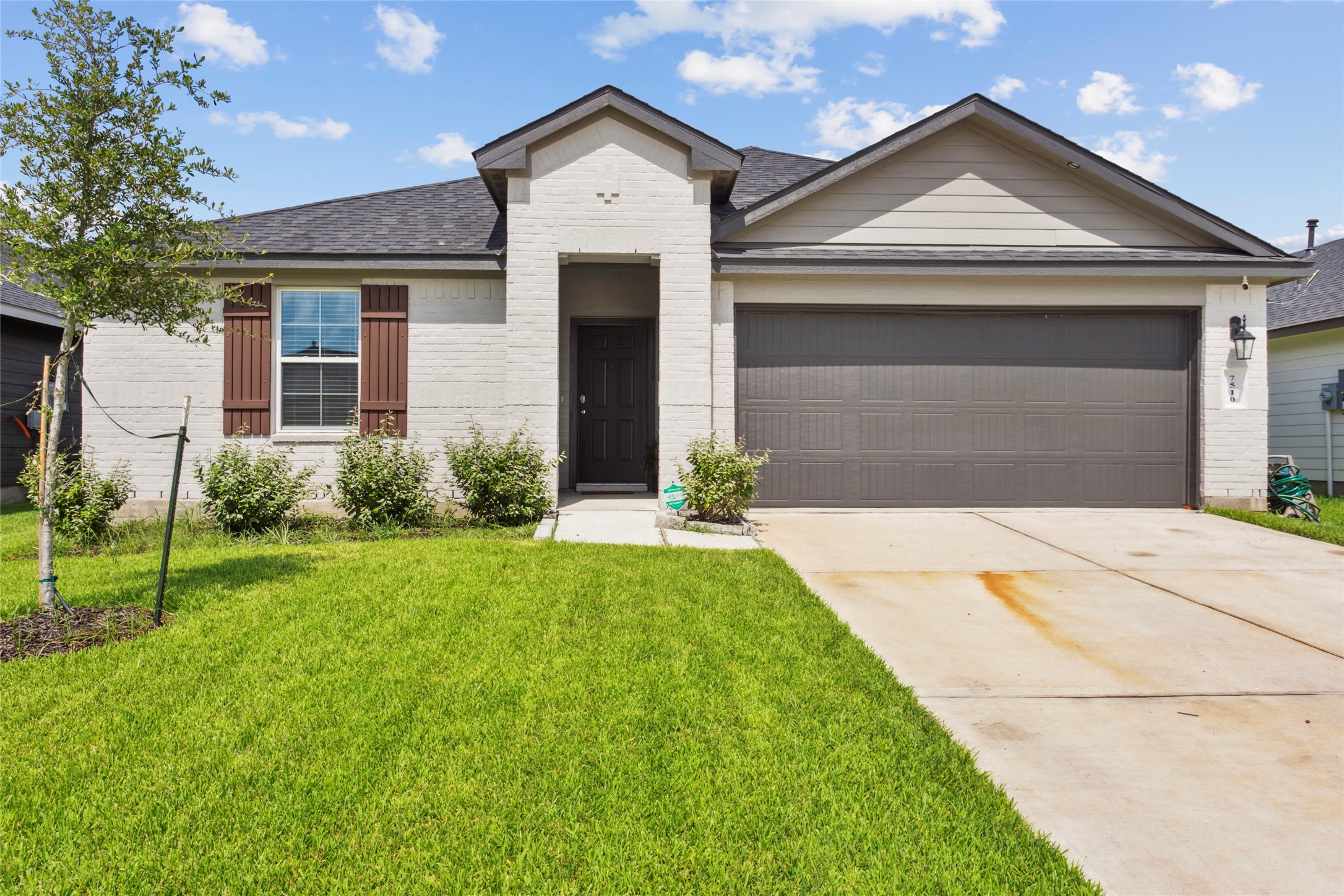 7510 Carson Court Rosharon, TX 77583 - Photo 23 of 23 a front view of a house with a yard and garage