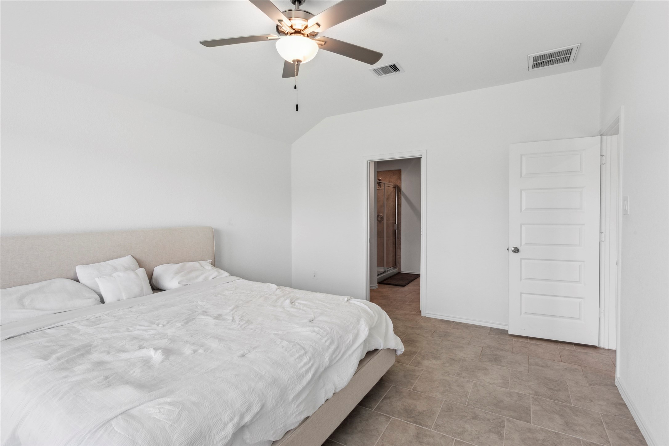 7510 Carson Court Rosharon, TX 77583 - Photo 9 of 23 a bedroom with a bed and a chandelier